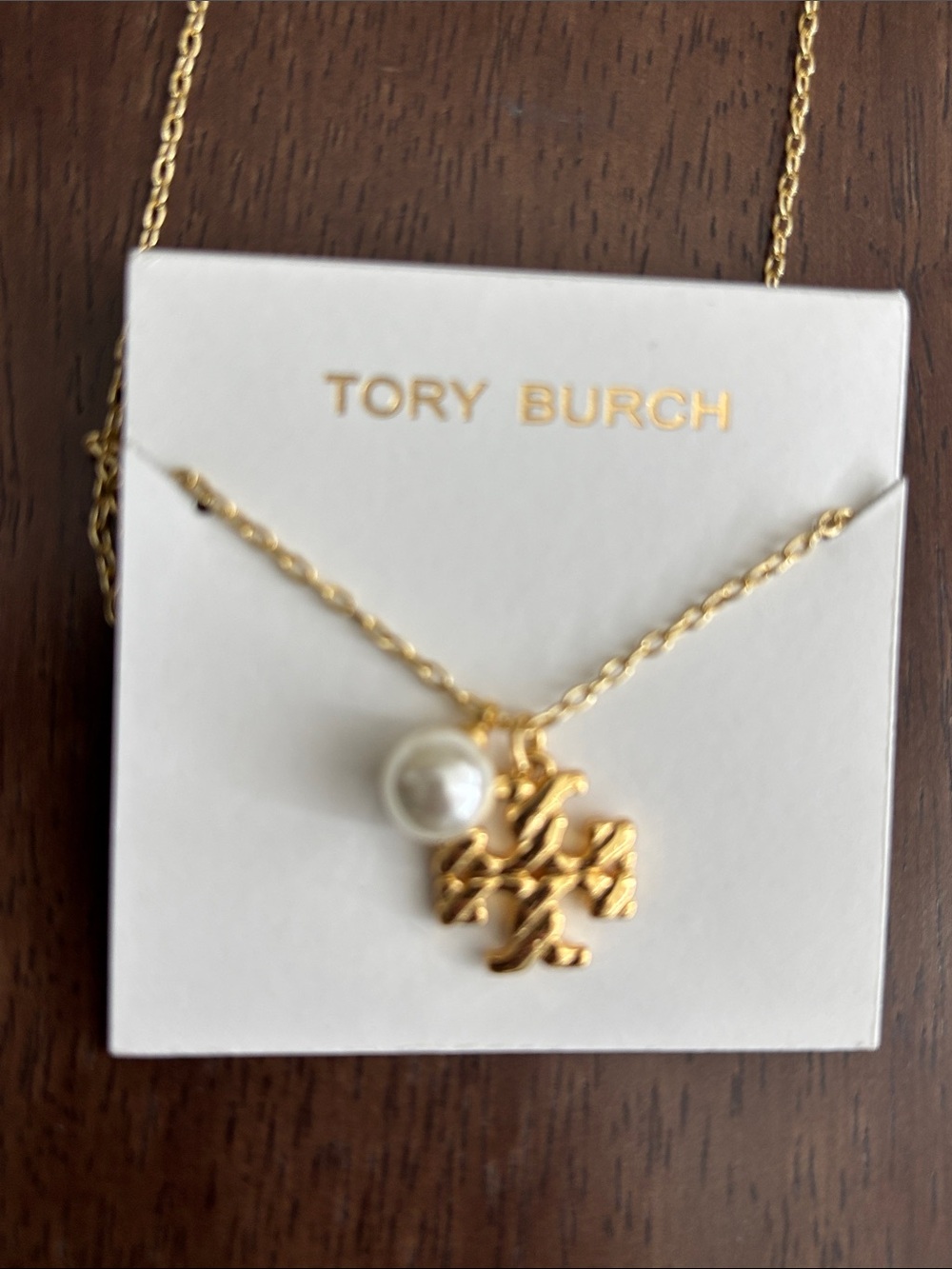 Brand new Tory Burch Gold Logo Necklace with Pearl Charm